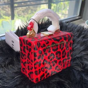 Brandon Blackwood mini Kendrick trunk red leopard